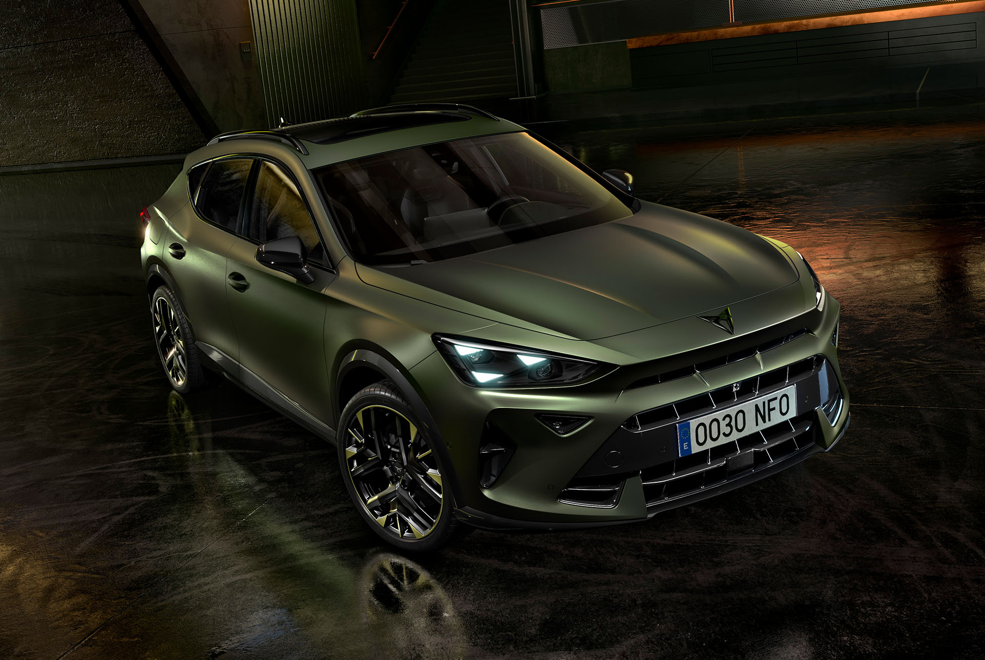 CUPRA Formentor tribe edition parked in an industrial parking setting that highlights its manganese matt colour. 