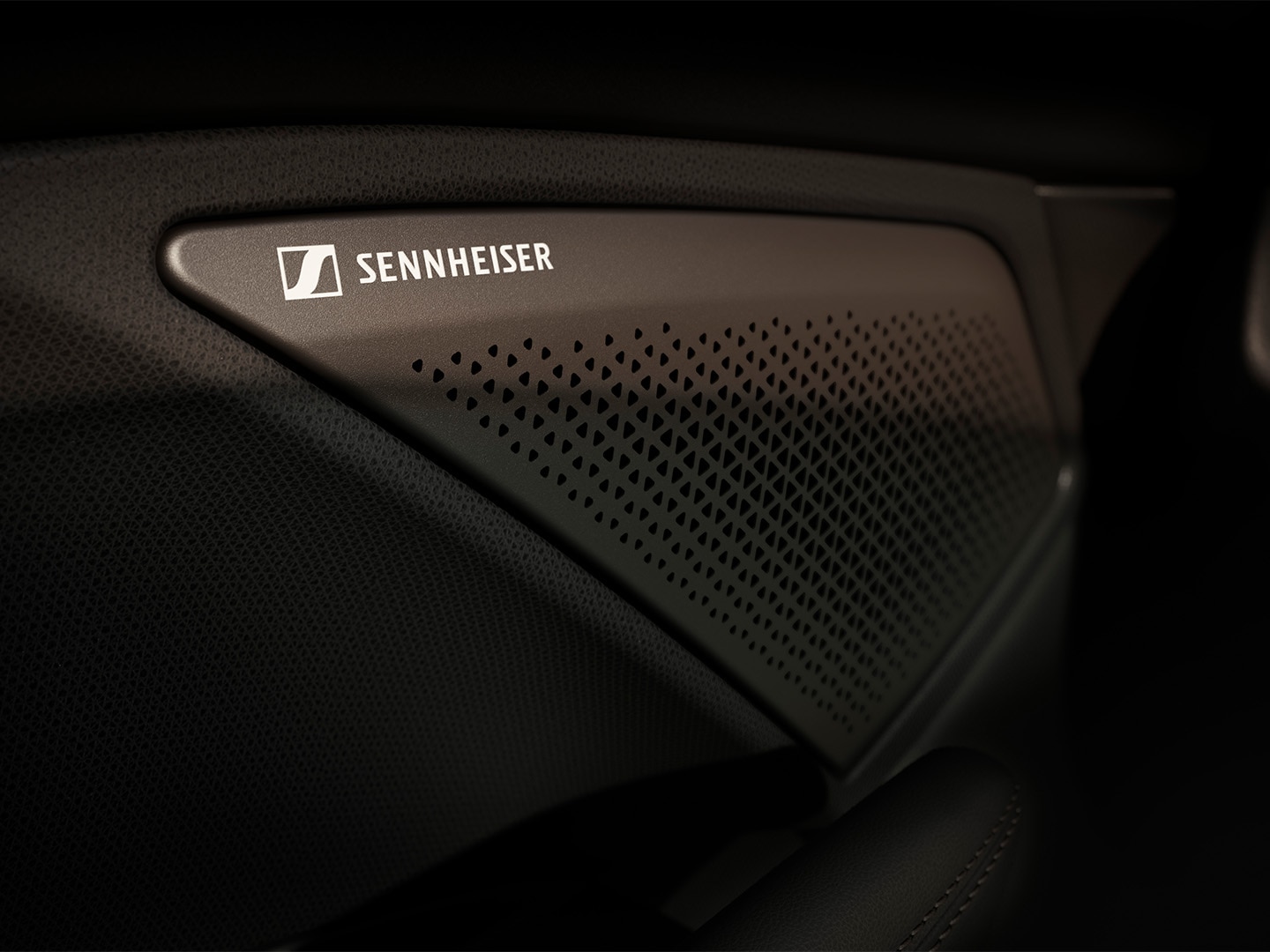 Sennheiser AMBEO Immersive Sound System high fidelity 12-speaker audio system in the CUPRA Terramar showcasing the Sennheiser logo. Close up view.